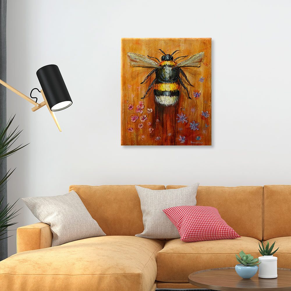 Blossom and Buzz painting in living space - Pollinator art creating focal point over sofa