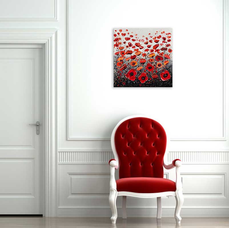 Grey poppy art above red chair