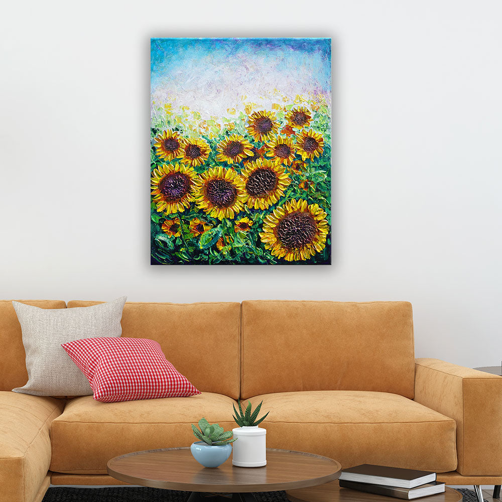 Sunflower art above orange sofa