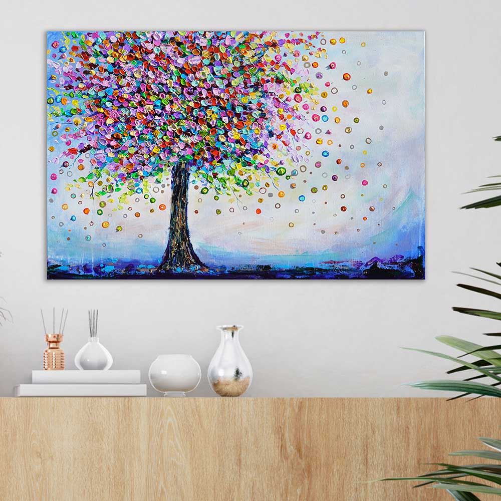 Colorful tree painting above sideboard