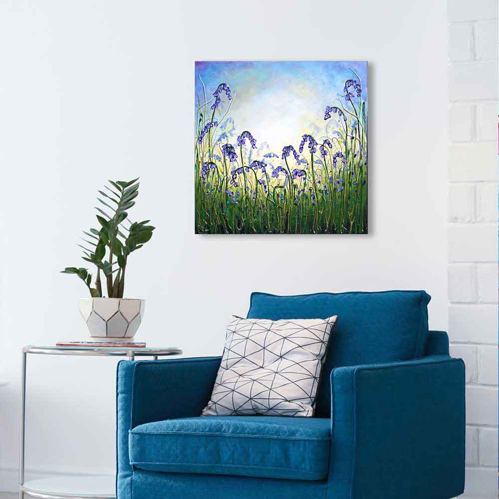 Bluebell Dance by Amanda Dagg above teal chair - Spring artwork complementing interior decor 