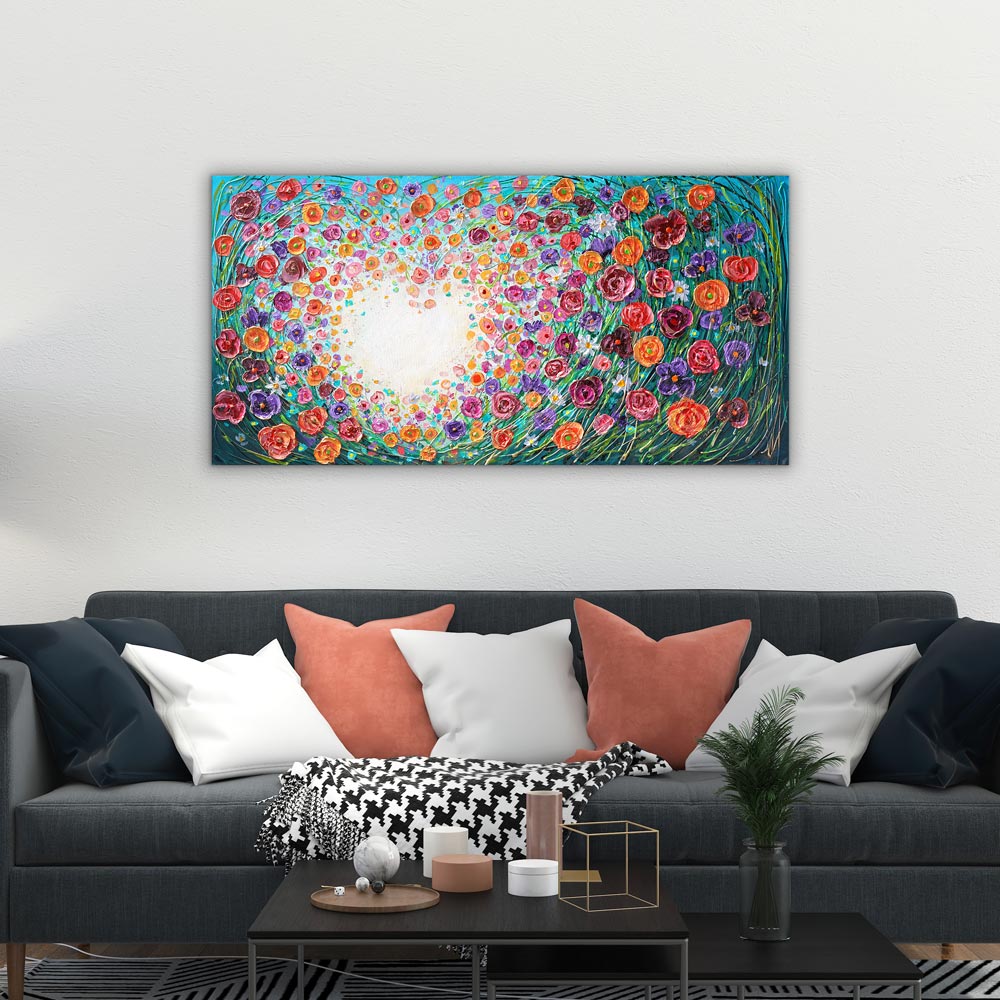 Floral painting above black sofa