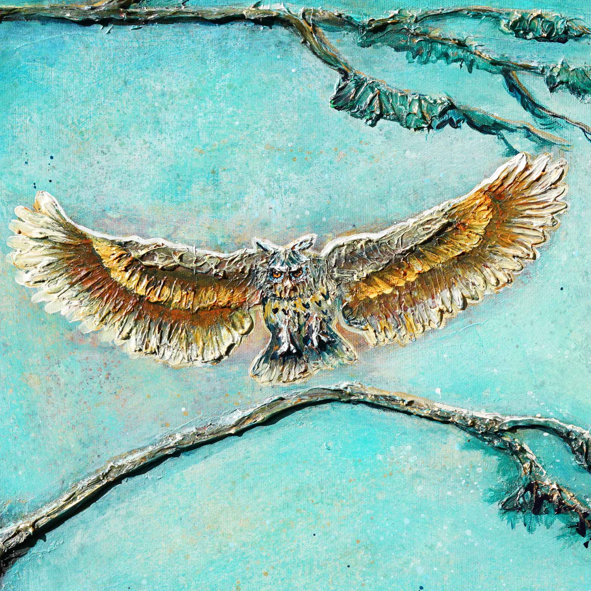 Metallic eagle sculpture on a textured turquoise background