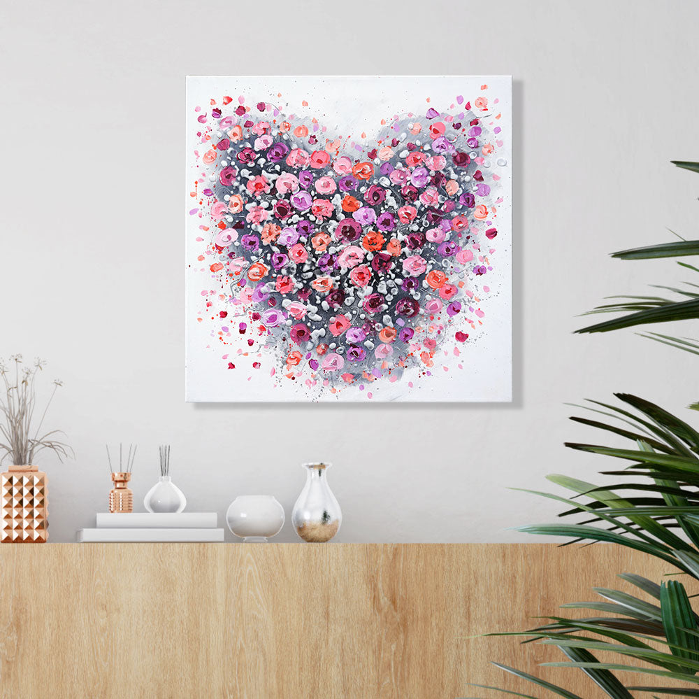 Floral heart art above sideboard