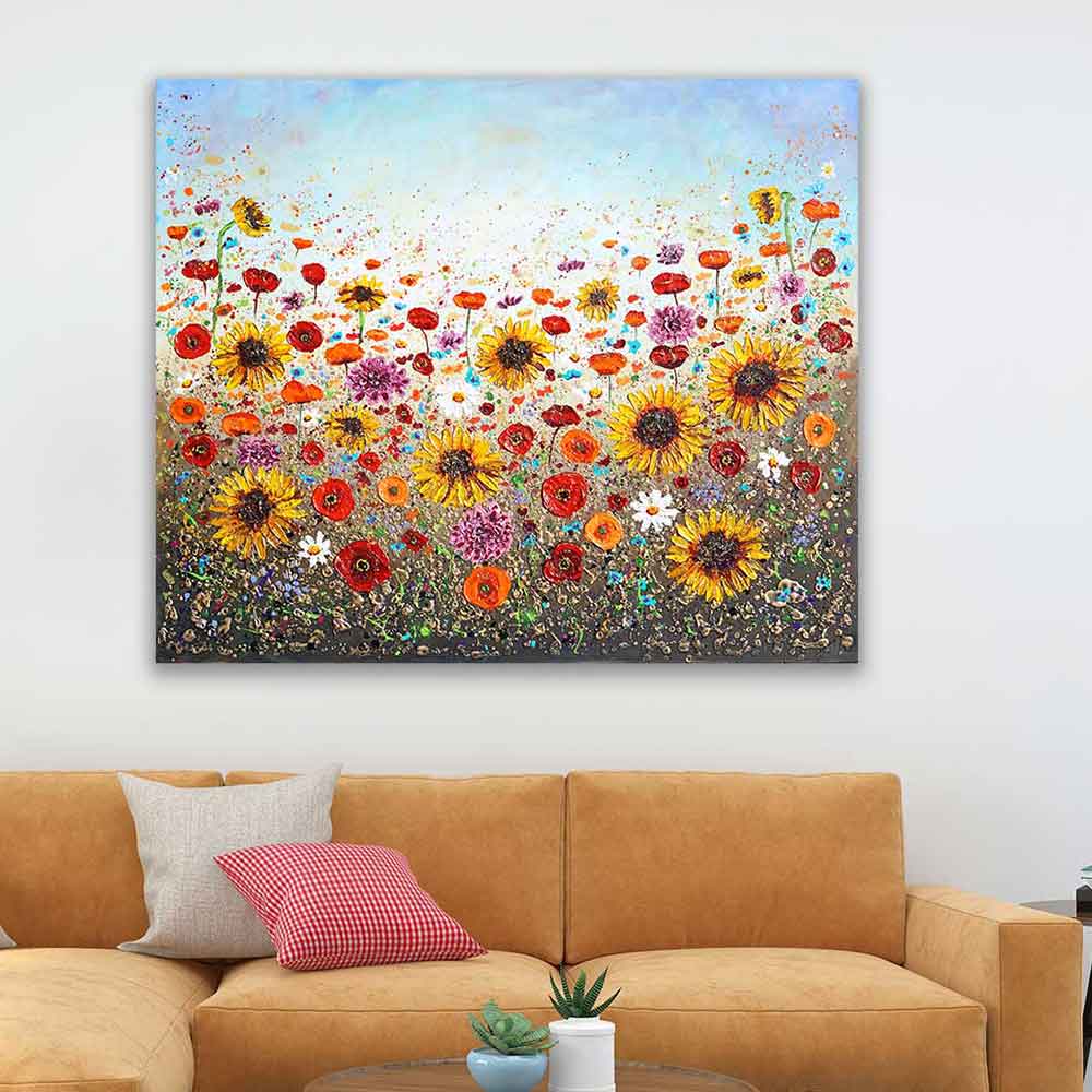 Wildflower painting above orange sofa